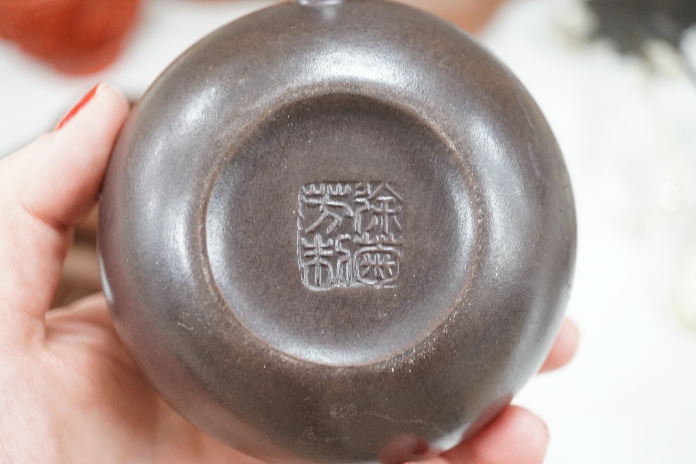 A quantity of Chinese Yixing teapots, a cinnabar resin jar and cover, a Samson teapot etc.